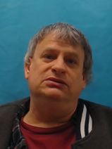 MARK LESLIE POFFENBERGER